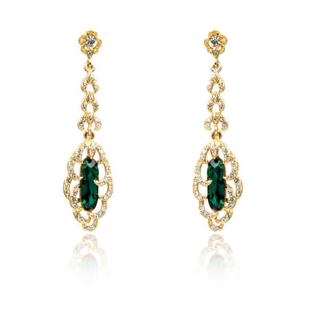 Pair of emerald earrings isolated on white backgroundの写真素材