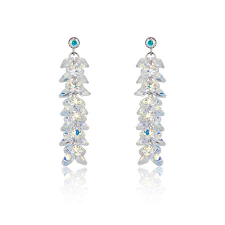 Pair of diamond earrings isolated on white backgroundの写真素材