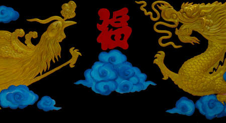 Double Chinese dragon and phoenix on black background.の写真素材