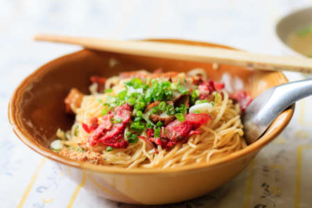Wheat noodles with vegetables and porkの写真素材