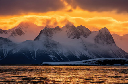 Sunset in Antarctica. Icebergs and mountains in the ocean.の素材