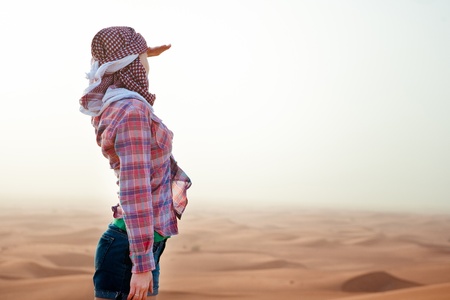 Young woman in the desert  United Arab Emiratesの写真素材