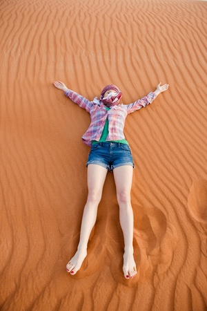 Young woman in the desert  United Arab Emiratesの写真素材