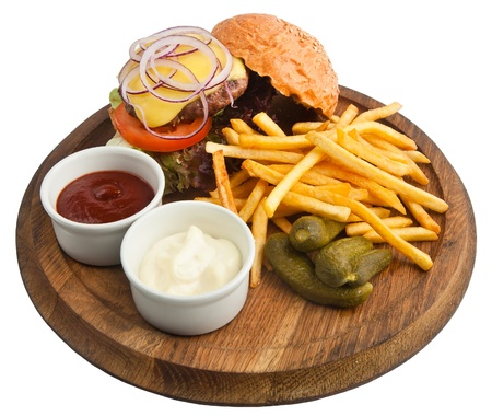 hamburger with fries, sauce and picklesの写真素材