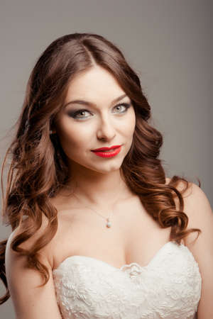 Portrait of the young beautiful bride posing in studioの写真素材