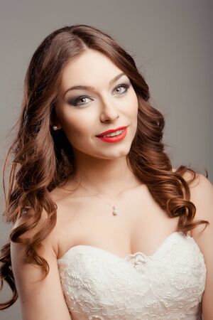 Portrait of the young beautiful bride posing in studioの写真素材