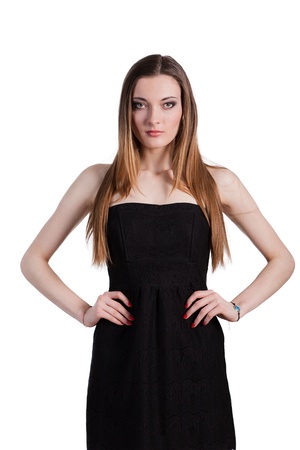 Attractive young woman in a black dress smiling and looking at camera.の写真素材
