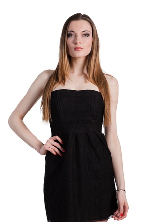 Attractive young woman in a black dress smiling and looking at camera.の写真素材