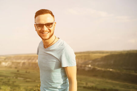 Handsome man outdoors portrait with a retro vintage 