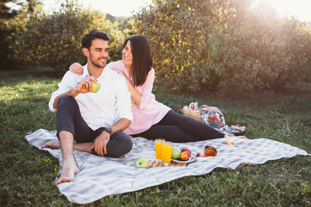 Pregnant couple on picnicの写真素材