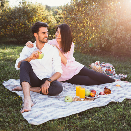 Pregnant couple on picnicの写真素材