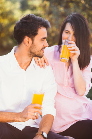 Pregnant couple on picnicの写真素材