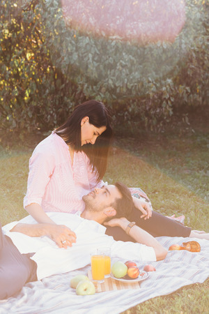 Pregnant couple on picnicの写真素材