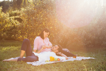 Pregnant couple on picnicの写真素材