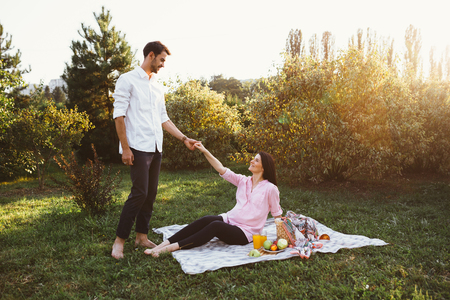 Pregnant couple on picnicの写真素材