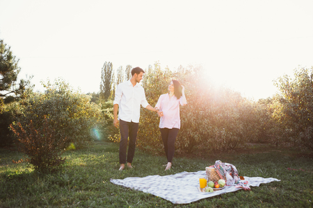 Pregnant couple on picnicの写真素材