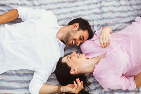 Happy and young pregnant coupleの写真素材