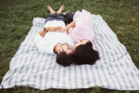 Happy and young pregnant coupleの写真素材