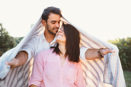 Happy and young pregnant coupleの写真素材
