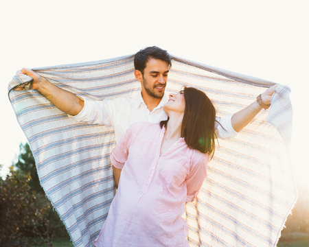 Happy and young pregnant coupleの写真素材
