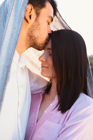 Happy and young pregnant coupleの写真素材