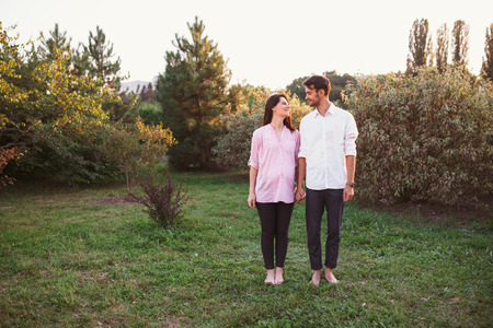 Happy and young pregnant coupleの写真素材