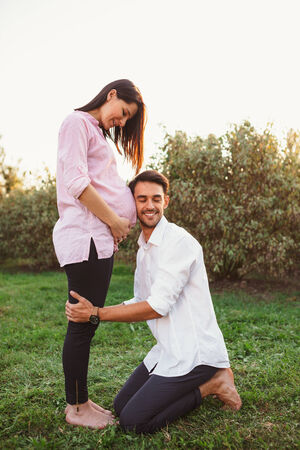 Happy and young pregnant coupleの写真素材