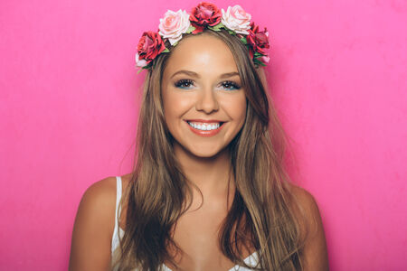 Young woman with flowers in her hairの写真素材