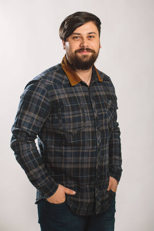 Guy in a plaid shirt over white background