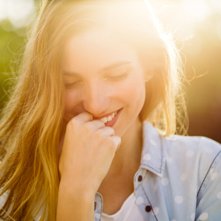 Portrait of charming smiling girlの写真素材