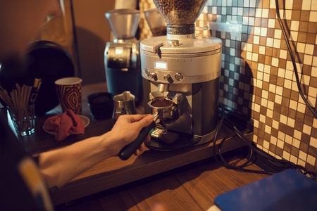 Barista at work in a coffee shop. Preparation service conceptの写真素材