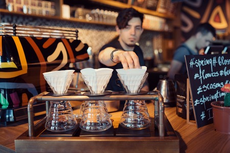 Barista at work in a coffee shop. Preparation service conceptの写真素材