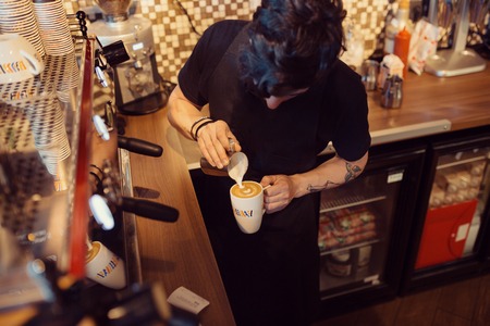 Barista at work in a coffee shop. Preparation service conceptの写真素材