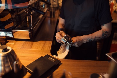 Barista at work in a coffee shop. Preparation service conceptの写真素材
