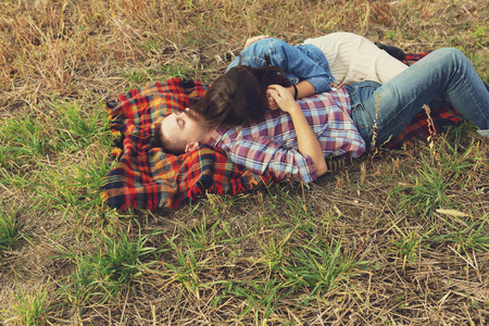 Romantic young couple in love outdoors in the countrysideの写真素材