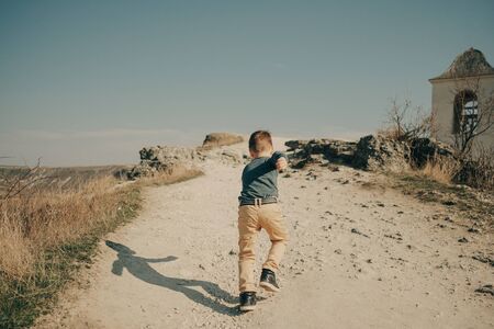 Little young caucasian boy in nature, childhood in image with copy spaceの写真素材