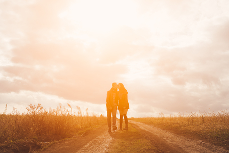Young modern stylish couple outdoors. Romantic young couple in love outdoors in the countrysideの写真素材