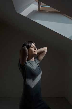 Smiling girl with closed eyes breathing fresh airの写真素材