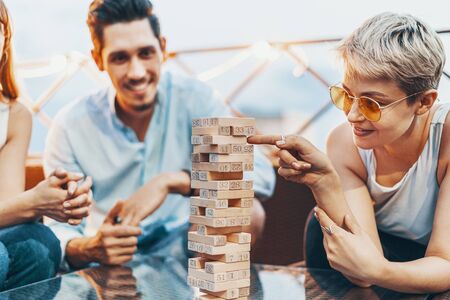 The company of young people playing wooden blocksの写真素材