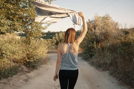 Young girl walks in a career. Girl enjoying a stroll on a warm summer evening
