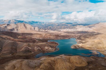 Beautiful scene of rocky mountains with a lake on the top and sky in background. Gundogmuz, Antalya, Turkey.の写真素材