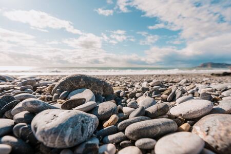 View of stone Seashore. Sea and sky on horizon. Nature backgroundsの写真素材