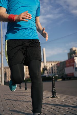 Man running in the city. Fitness workout, sport lifestyle concept.