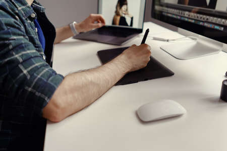 Graphic Designer working hands with interactive pen display, digital Drawing tablet and Pen. Concept...