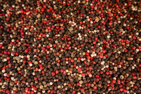 Dry organic Mixed Pepper top view background or texture. Healthy spices, seeds and herbal products.
