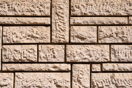 Abstract weathered texture stained old stucco light gray and aged paint white brick wall background...