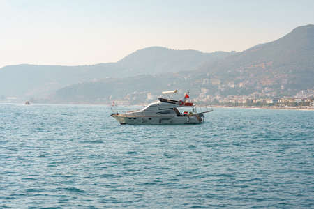 Sailboat in the sea in the evening sunlight over beautiful sea background, luxury summer adventure,...