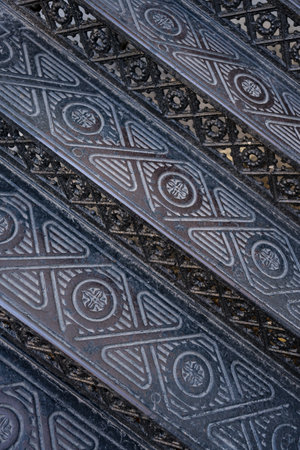 Vintage metallic ornate stairs. Backgrounds and textures