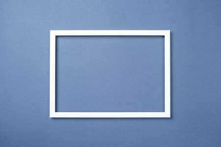 Dark blue background surrounding white frame.