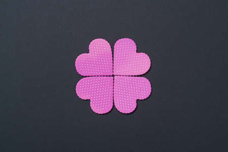 Paper elements in shape of hearts on black background. Symbol of love for Happy Womens, Mothers, Valentines Day, birthday greeting card design.の写真素材